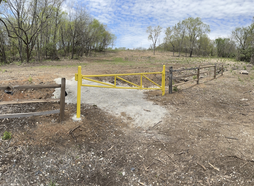 Yellow gate at the base of Bloody Hill  Yellow gate at the base of Bloody Hill