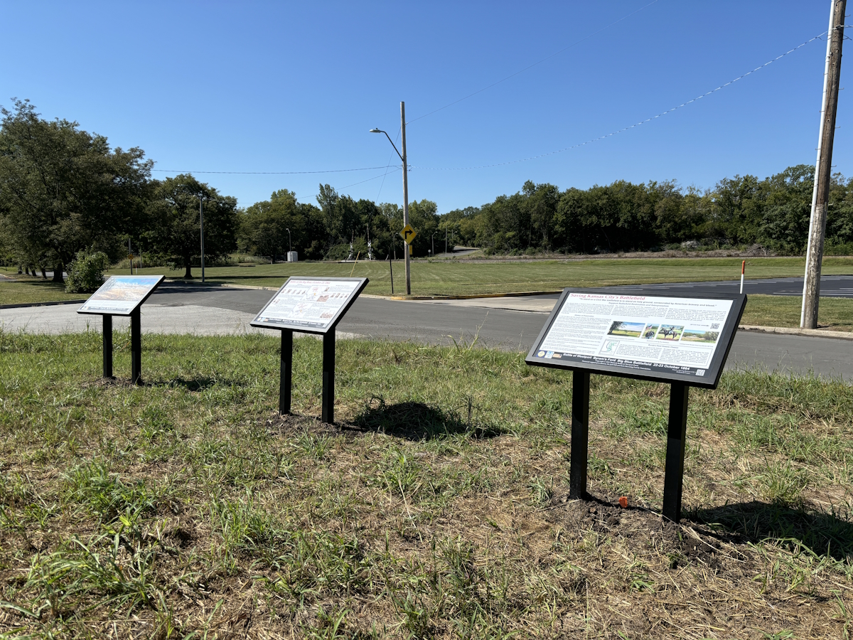 Three Historical Markers near yellow building at 5951 Manchester Trafficway