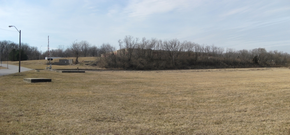 View of rocky ledge with route of Byram’s Ford Road to the left