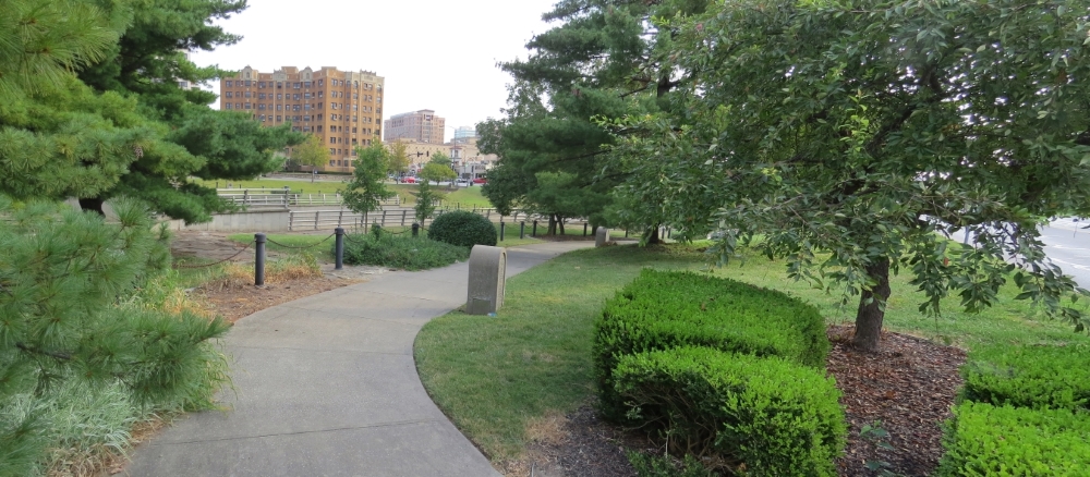 View walking to tour stop along south side of Brush Creek