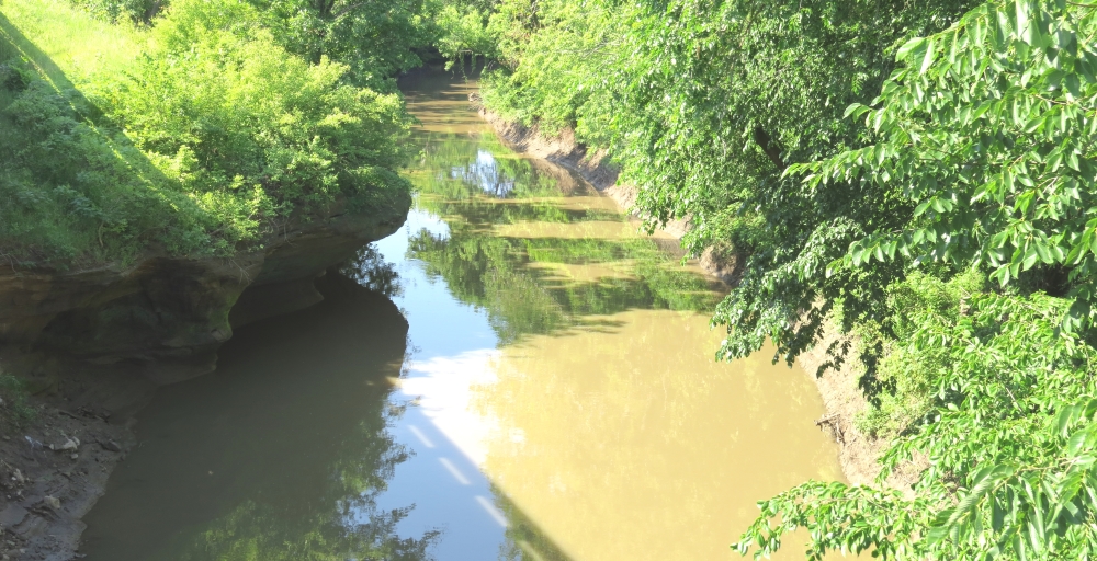 The limestone outcroppings seen on left bank are common along the banks of the Wakarusa River